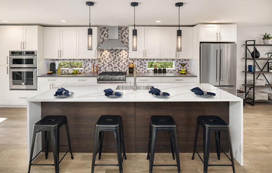 Satin White cabinets paired with textured melamine TSS Carbone on the island