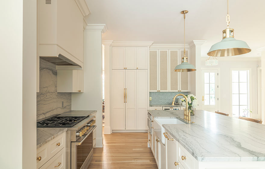 Beautiful cream painted cabinets add warmth to this kitchen.