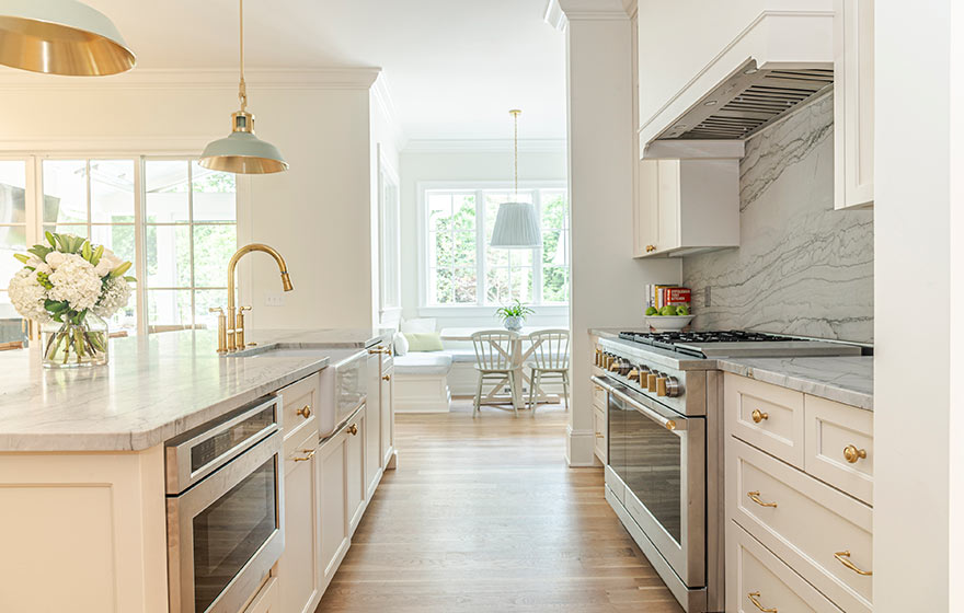 Beautiful cream painted cabinets add warmth to this kitchen.