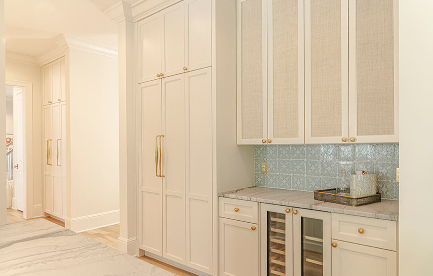 Beautiful cream painted cabinets add warmth to this kitchen.