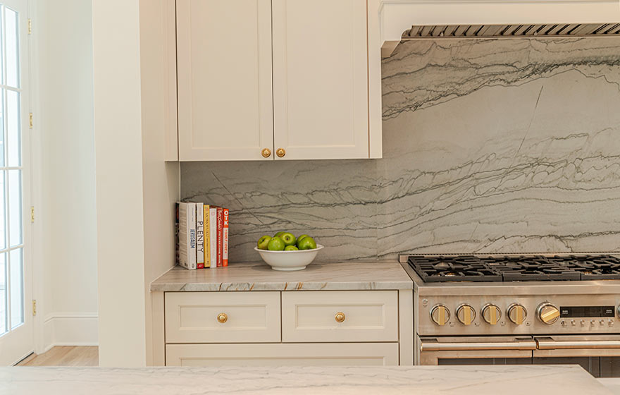 Beautiful cream painted cabinets add warmth to this kitchen.