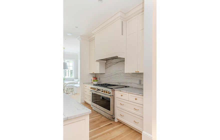 Beautiful cream painted cabinets add warmth to this kitchen.