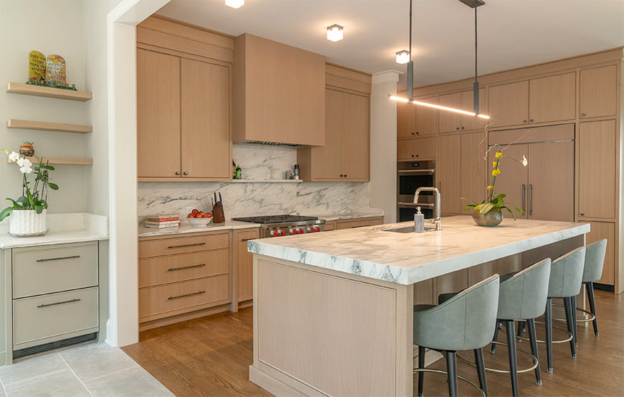 The popular Vienna style with beaded outside detail elevates this space featuring Rift White Oak veneer doors