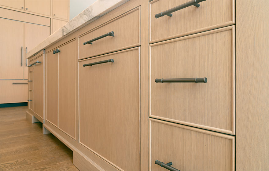 The popular Vienna style with beaded outside detail elevates this space featuring Rift White Oak veneer doors