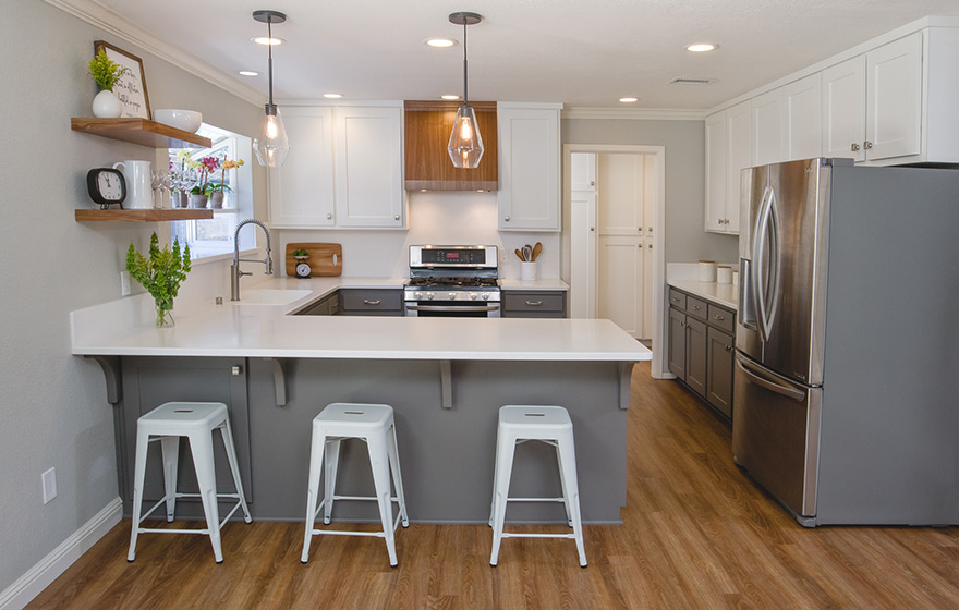 A fresh look and opened up layout shine in this refaced kitchen. 