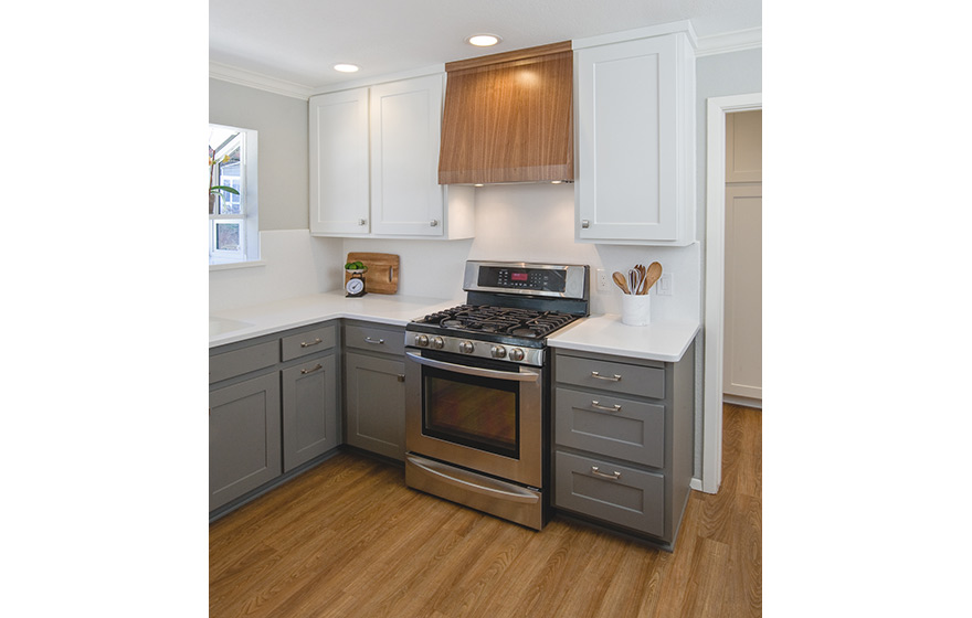 A fresh look and opened up layout shine in this refaced kitchen. 