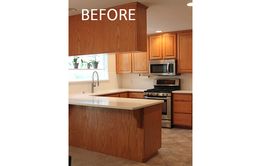 A fresh look and opened up layout shine in this refaced kitchen. 