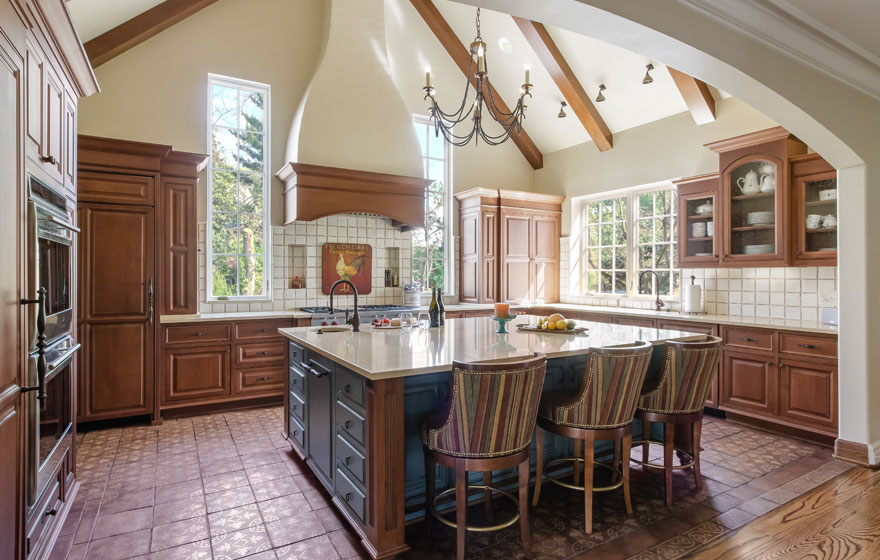 A customized door style is featured in this beautiful, bright kitchen.