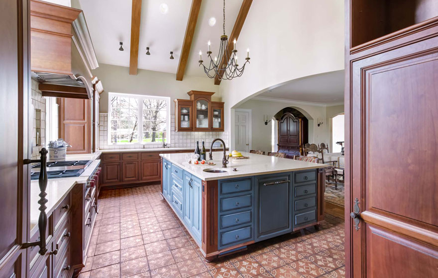 A customized door style is featured in this beautiful, bright kitchen.