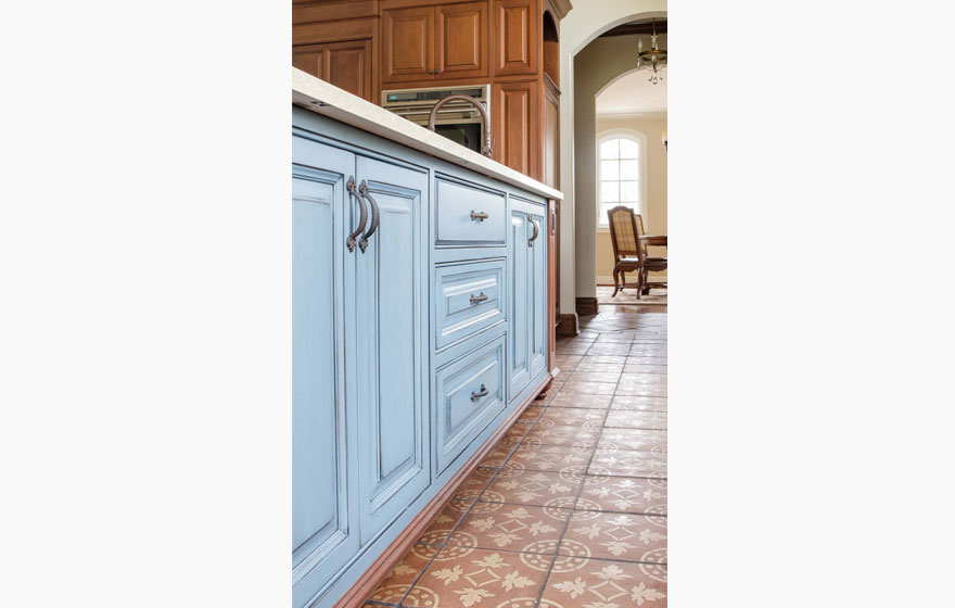 A customized door style is featured in this beautiful, bright kitchen.