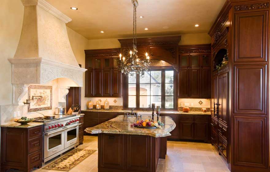 Dramatic ceiling heights and deep, rich tones in the cabinetry make this kitchen leave a lasting impression.