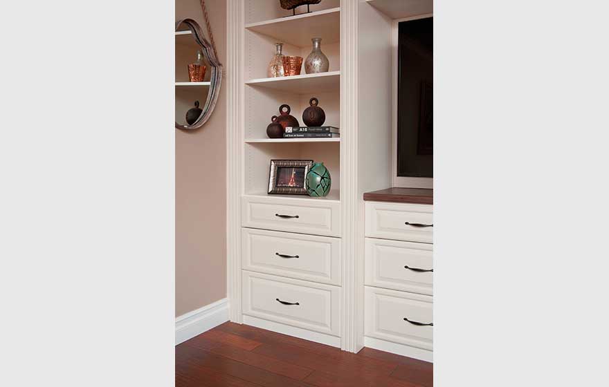 Functional storage and shelving beautifully fill this built-in guest room entertainment center.