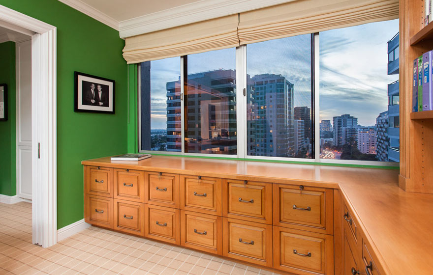Natural wood tones and a bright, dramatic wall color pair together to create an energizing space in this home.
