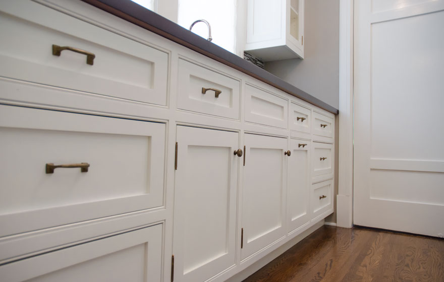 Off the kitchen area, this butlers pantry offers excellent storage space.