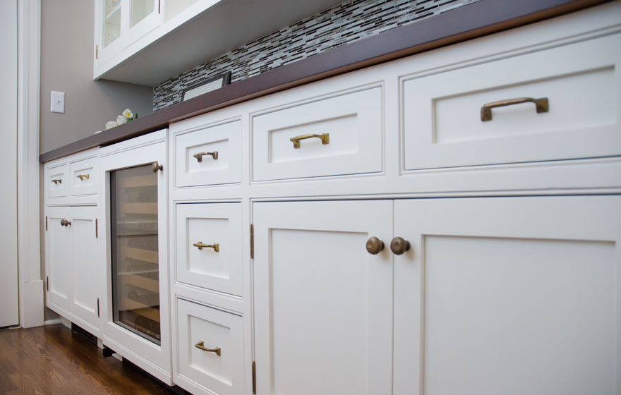 Off the kitchen area, this butlers pantry offers excellent storage space.