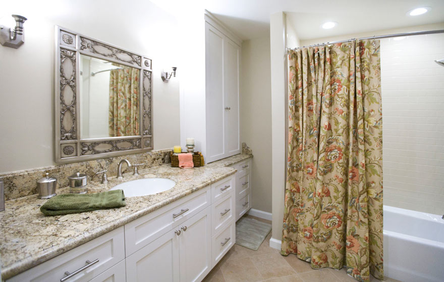 The minimalistic door design of this bathroom allows the detailed accessories to stylize the room.