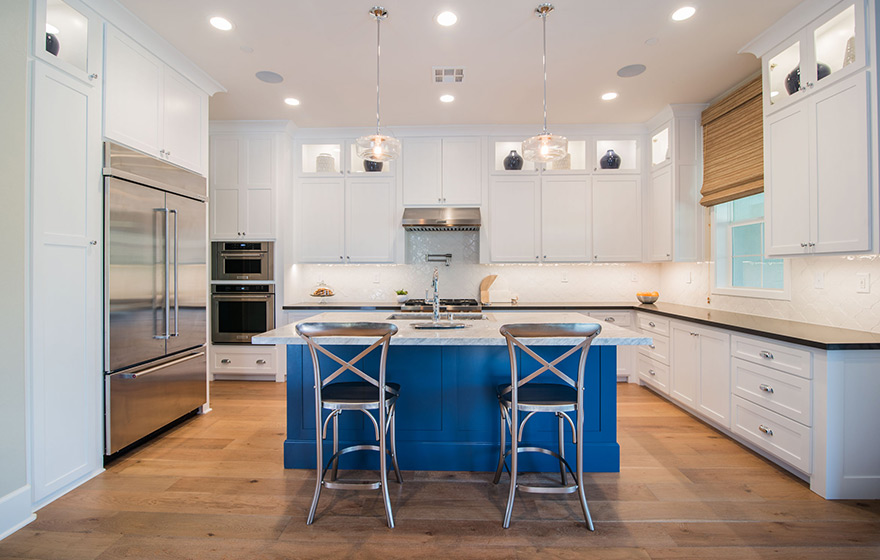 A dramatic pop of color on the island adds character to this Streamline® RTA Cabinet kitchen.