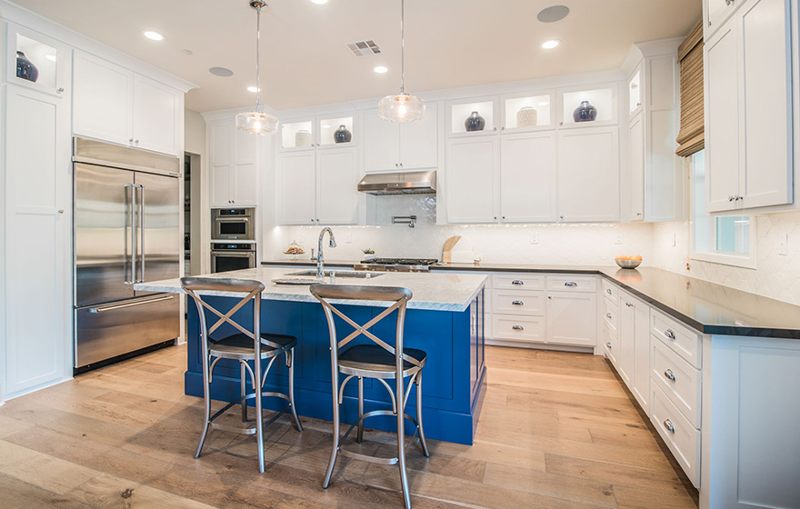 A dramatic pop of color on the island adds character to this Streamline® RTA Cabinet kitchen.