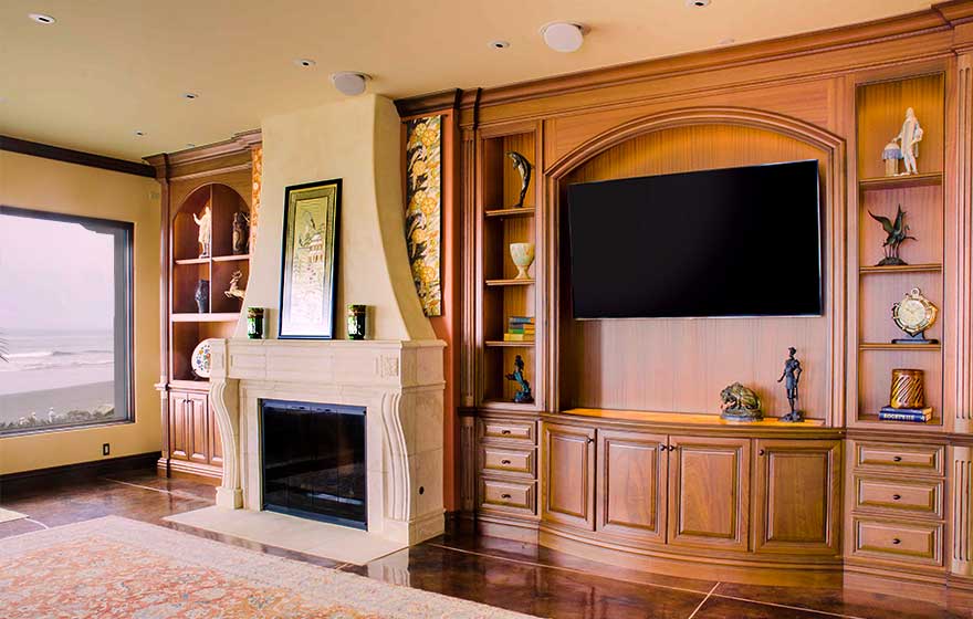 The Ponderosa 3/4" (839) doors' curves highlight the beautiful natural color and grain of the Sapele material in this custom living room. 