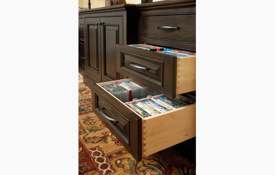 A custom applied molding door is displayed in this furniture piece, perfect for entertainment systems and display.