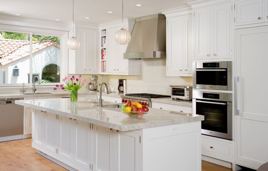 Custom designed wood cabinet doors were used in this stunning kitchen and dining space to bring a truly high end look.