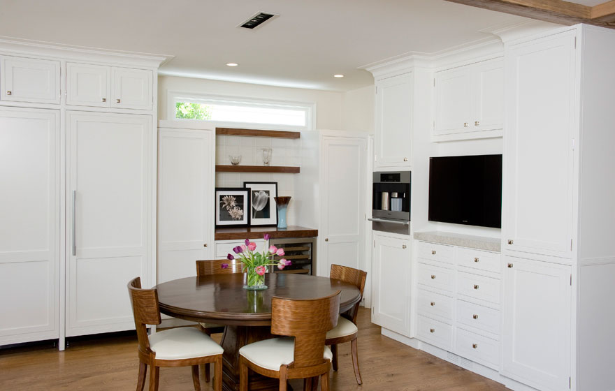 Custom designed wood cabinet doors were used in this stunning kitchen and dining space to bring a truly high end look.