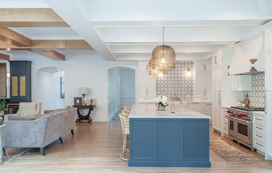 Beautiful blue paint add just the right amount of color to this stunning white kitchen