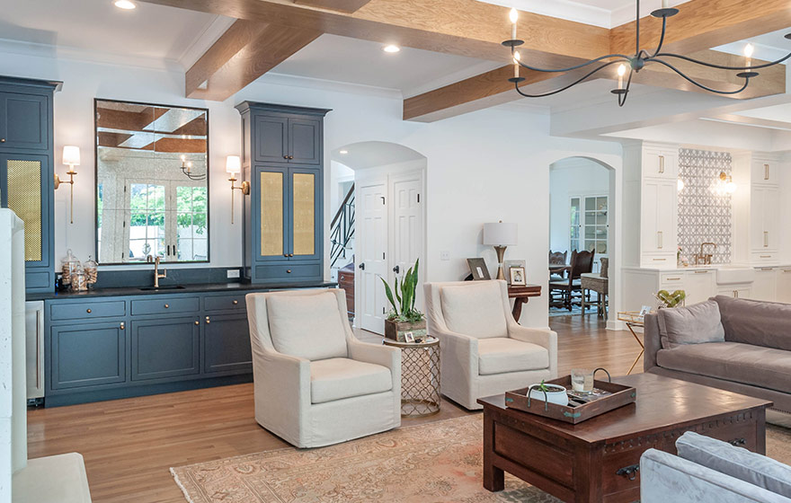 Beautiful blue paint add just the right amount of color to this stunning white kitchen