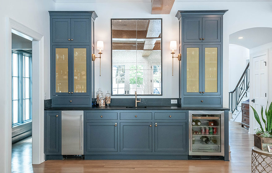 Beautiful blue paint add just the right amount of color to this stunning white kitchen