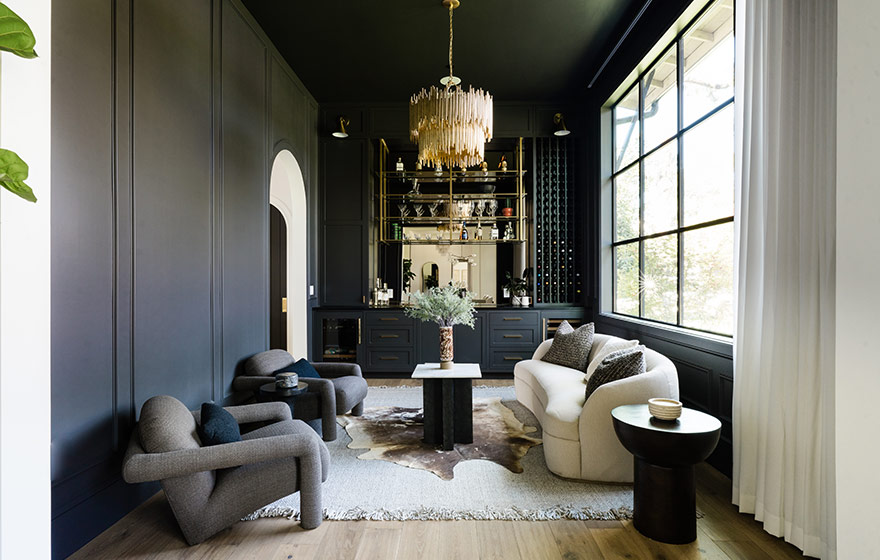 Dark paint adds drama and elegance to this inviting lounge area