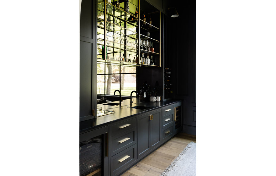 Dark paint adds drama and elegance to this inviting lounge area